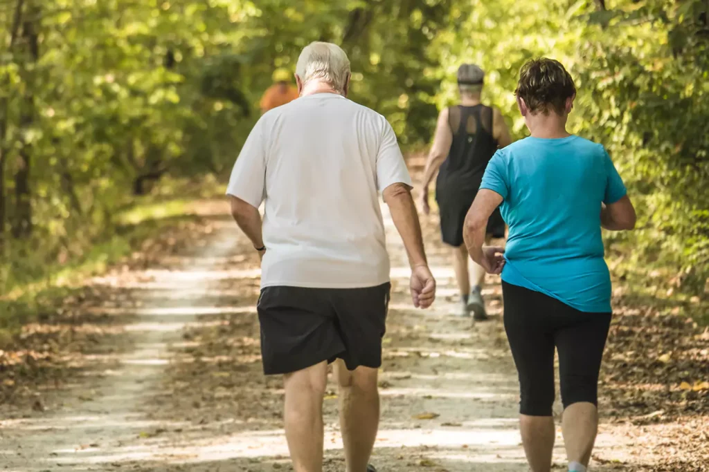 Elderly people walking outdoors